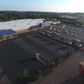 Aerial view of a business parking lot that has been freshly redone.