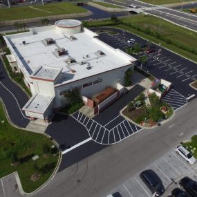 Aerial view of a business parking lot that has been freshly redone.