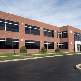 Business building with fresh asphalt in their parking lot.