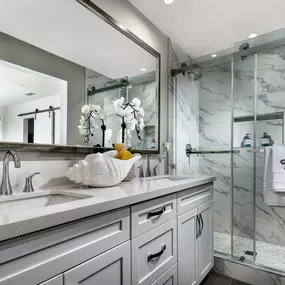 Spacious primary bathroom with double sink vanity