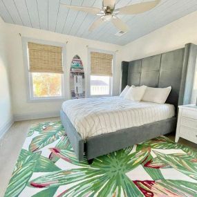 Loving this fun room with blue ceiling & trim, surf board and woven woods. We had a great day designing and installing with Local Budget Blinds teams.