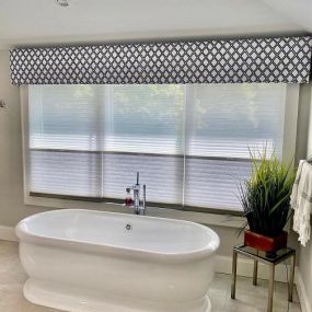 Who wants to soak in this fabulous tub? We added Hunter Douglas shades for privacy & light and topped this window off with a simple cornice. Call Budget Blinds for all your custom window treatments at 201-387-0050! #BudgetBlindsParamusWestwood #HunterDouglas #TriLightShades #CustomInspiredCornice