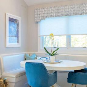 This is the perfect place to have a cup of morning coffee...We added an automated Lutron shade for sun control and topped it off with nailhead cornice.