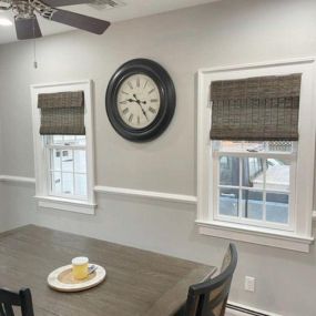 We love the contrast of these dark grey woven woods for this dining area! Call us for all your custom window treatments 201-387-0050.