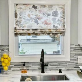 Love this washed out floral Roman shade for this kitchen...so . Makes washing dishes so much better.