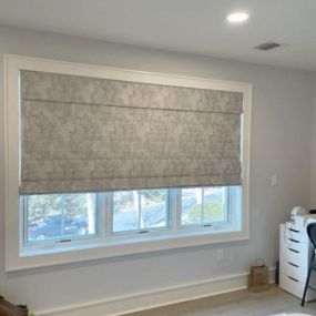 When fabric comes to life.... We added this cordless room darkening Roman shade to this teens room for a little glam...