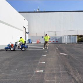 Employees working on Line Striping Project for Enagic Co in Torrance, CA