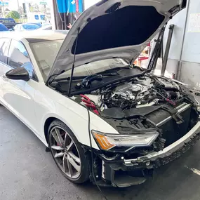 Detailed photo of Audi at auto body shop parking lot for collision repair