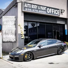 Detailed photo of Porsche waiting at auto body shop parking lot for collision repair