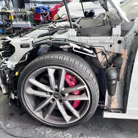 Detailed photo of Audi at auto body shop parking lot for collision repair