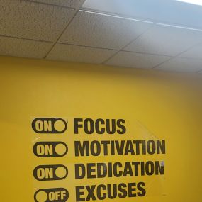 One Hour Heating & Air Conditioning offices with Logo on a yellow wall