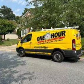 One Hour Heating & Air Conditioning Company van on curb in front of Cockeysville, MD home for AC Repair