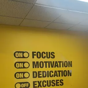 One Hour Heating & Air Conditioning offices with Logo on a yellow wall