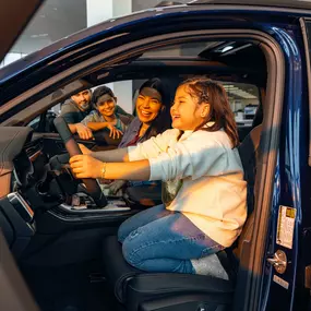 Family inside a blue Audi at Audi Pembroke Pines