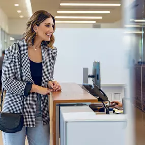 A customer at a desk at Laduredale MINI