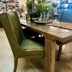 This solid wood table paired with green chairs is a showstopper! The warm tones of the wood and the sleek green seating create the perfect combination of style and comfort. It’s a versatile look that works beautifully for any space. Stop by and see it for yourself—it’s even better in person!
#missdaisys 
#dininginspo 
 #solidwoodfurniture 
#shoplocal