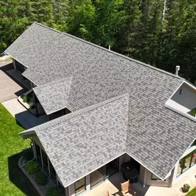 Architectural Roof Design: A bird’s-eye view of a contemporary home with an innovative, multi-layered roof design, emphasizing the architectural creativity and unique structure.