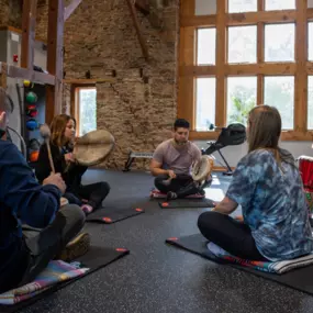 STR Behavioral Health Cedar Creek: Interior photo of the fitness area in our wellness center where individual can also engage in a drumming group at our residential mental health treatment facility.