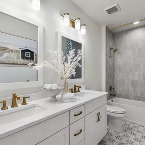 Generous secondary bathrooms with dual-sink vanities