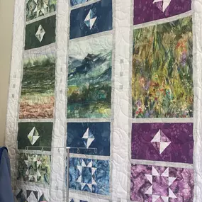 Modern quilt inspired by a breath taking Montana peaceful watercolor scene. Quilt size: 60.5