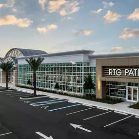 Exterior view of RTG Patio showroom with modern glass architecture.