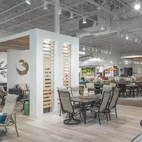 Modern patio showroom with a variety of dining and lounge setups.