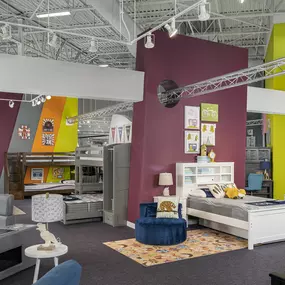 Colorful furniture setups for kids in a modern showroom.