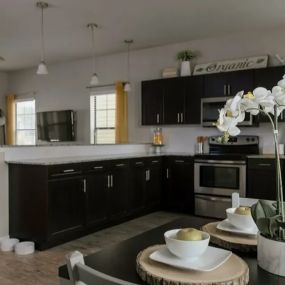 Spacious kitchen with ample storage space and stainless steel appliances.