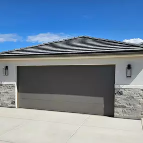 Modern gray garage door installed by Beacon Garage Doors, serving Riverdale, Ogden, North Ogden, South Ogden, Roy, and nearby areas.