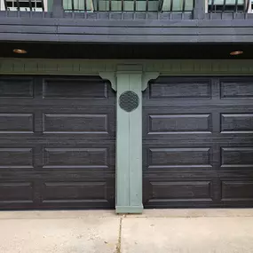 Stylish black garage door installation in Roy, Utah. Professionally installed by Beacon Garage Doors, featuring a modern paneled design that enhances both security and curb appeal.