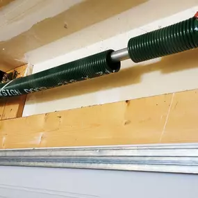 Garage door spring replacement in Weber County, Utah. High-quality torsion spring installed by Beacon Garage Doors to restore smooth and reliable garage door operation.