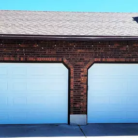 Newly installed twin garage doors in Layton, Utah. Expertly installed by Beacon Garage Doors to enhance curb appeal, security, and smooth functionality.