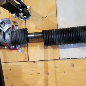 Garage door spring replacement in Davis County, Utah. Professionally installed high-tension torsion spring by Beacon Garage Doors to ensure smooth and safe operation.