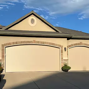 Residential garage door installation in Roy, Utah by Beacon Garage Doors.