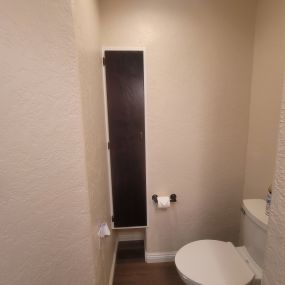a picture of a finished bathroom with a toilet