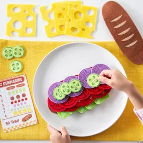 Open your own sandwich shop! This deliciously educational game lets children explore mathematical concepts while they build sandwiches from durable felt food pieces. Kids will practice counting and adding as they follow the menu cards to place colorful vegetable, meat and cheese items on each sandwich.