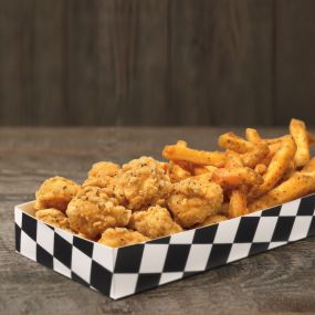After the very first one of these habit-forming, crispy, juicy, perfectly seasoned, all white meat chicken bites, you’ll be obsessing over them. Order them by the half pound, or get them in a box with our Famous Seasoned Fries.