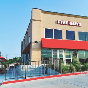 Exterior photograph of the Five Guys restaurant at 4724 Lakeview Parkway in Rowlett, Texas.