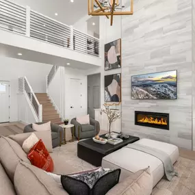 The two-story great room boasts a gas fireplace.