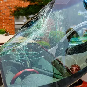 A skilled technician from First Class Auto Glass NC is seen carefully removing a shattered windshield from a vehicle. This is part of the company’s mobile auto glass repair service, offered throughout Mooresville, NC, and nearby areas like Statesville, Kannapolis, and China Grove. First Class Auto Glass NC specializes in windshield crack repair, windshield replacement, and other auto glass services. Customers enjoy the convenience of a mobile repair team that comes to them, ensuring fast and eff