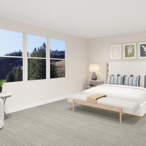 Spacious primary bedroom with large windows