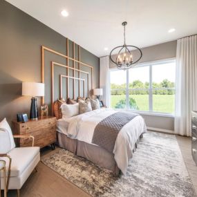 Luxurious first-floor primary bedroom suites