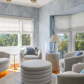 Flat Roman Shades in a sitting room.