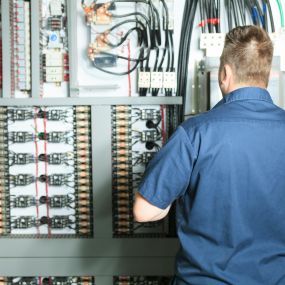 Electrician working on a panel