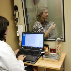 Dr. Sheri Gostomelsky conducting a hearing test