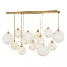 Mesmerizingly asymmetrical with a bohemian, mid-century modern flair, Skye showcases stunning globes of clear or cased opal glass with off-center openings. Slender rings and delicate details in Heritage Brass or Black finishes pull the look together, while adjustable wires allow you to create the perfect look for your space.