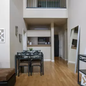 Fully furnished living area with spacious kitchen and breakfast bar.