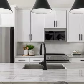 Kitchen with a large center island and stainless steel appliances