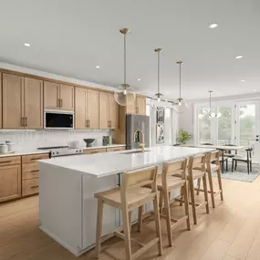 Gourmet kitchen boasts a large center island and stainless steel appliances