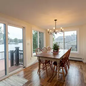 Custom built sunroom attached to a composite deck with railings